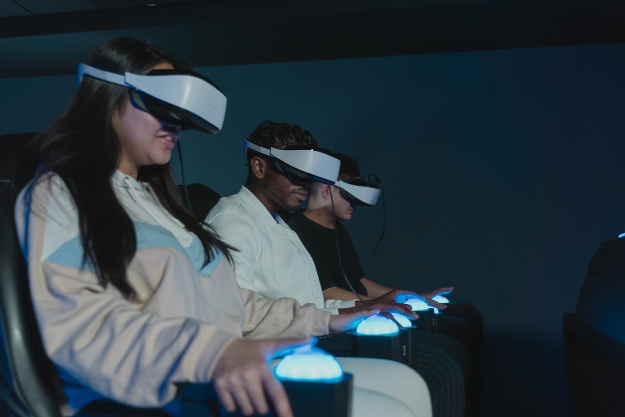 Adults engaged in a thrilling virtual reality simulation wearing advanced VR headsets.